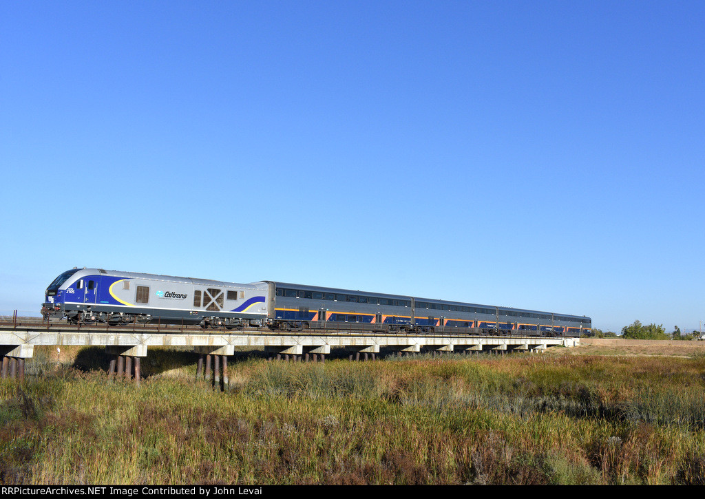 Amtrak Capitol Corridor Train # 528, being pushed by SC-44 # 2105, races across the Guadalupe River bridge about a minute after departing Santa Clara/Great America Station